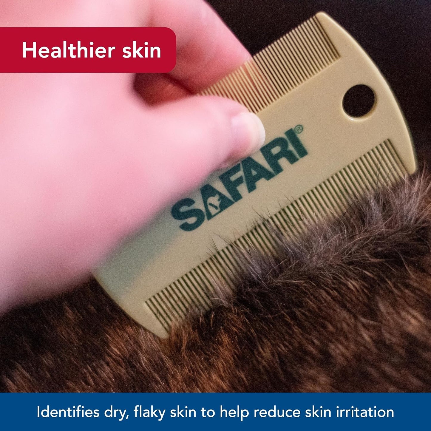 Hand holding Coastal Pet Safari flea comb demonstrating ergonomic grip
