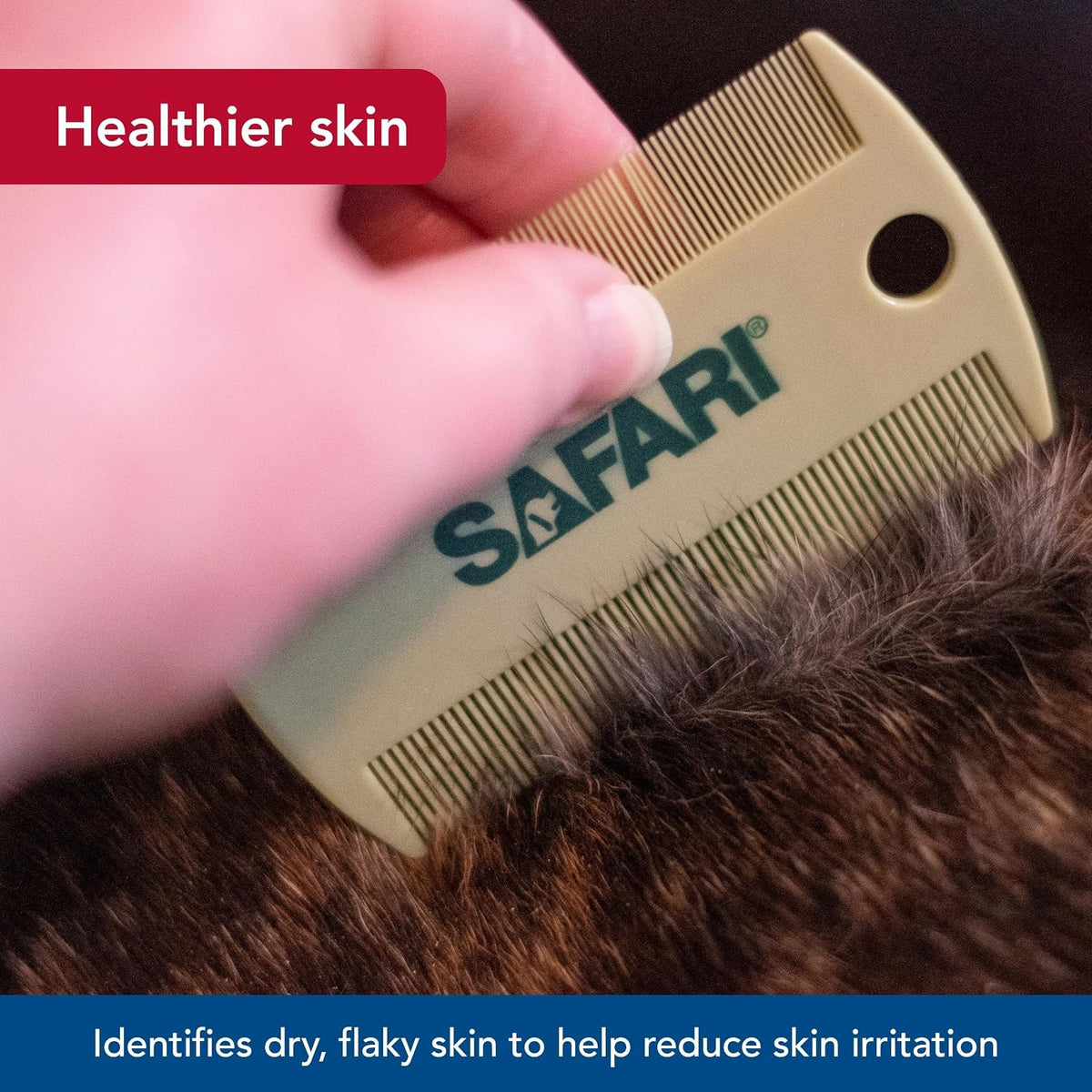 Hand holding Coastal Pet Safari flea comb demonstrating ergonomic grip