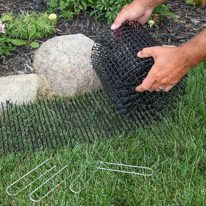 Hands cutting Tapix cat scat mat for custom fit