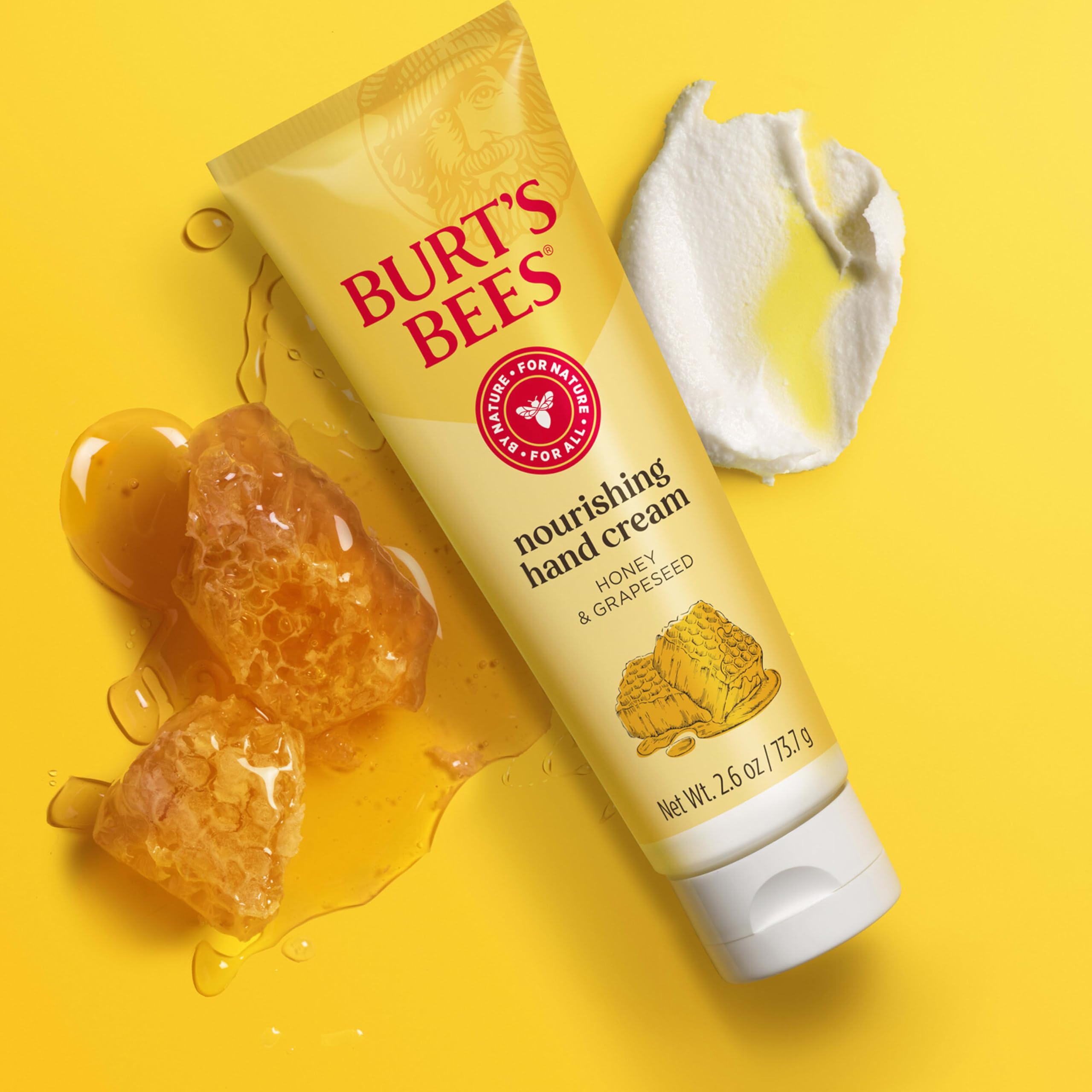 Squeezed tube of Burt's Bees Grapeseed Oil Hand Cream demonstrating its rich texture and emollient consistency.