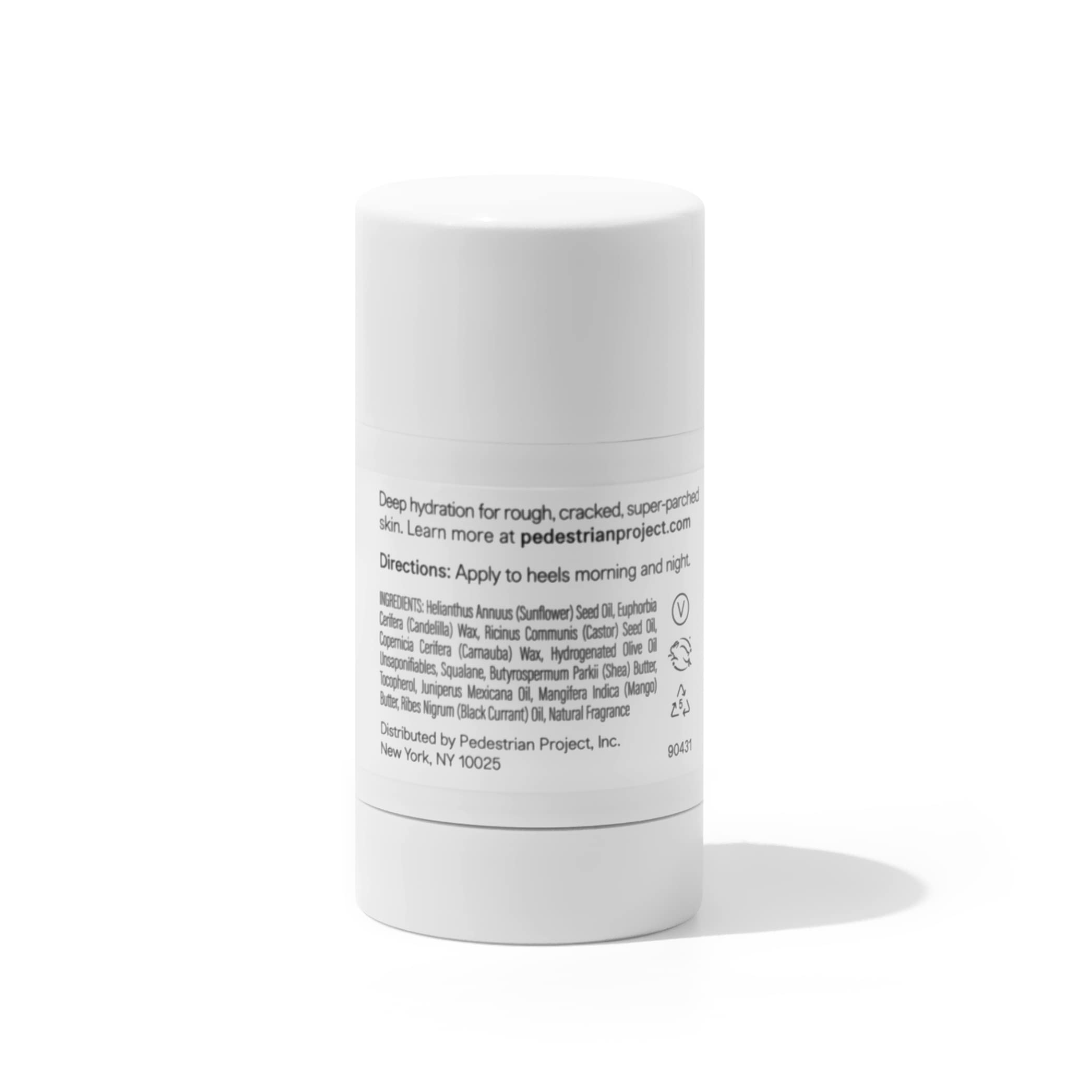 Pedestrian Project foot balm stick with cap off displaying the solid moisturizing therapeutic butter