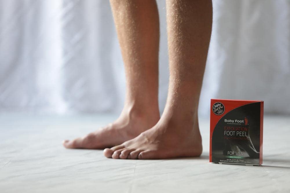 Side view of Baby Foot Mint Scented pair for rough dry feet repair.