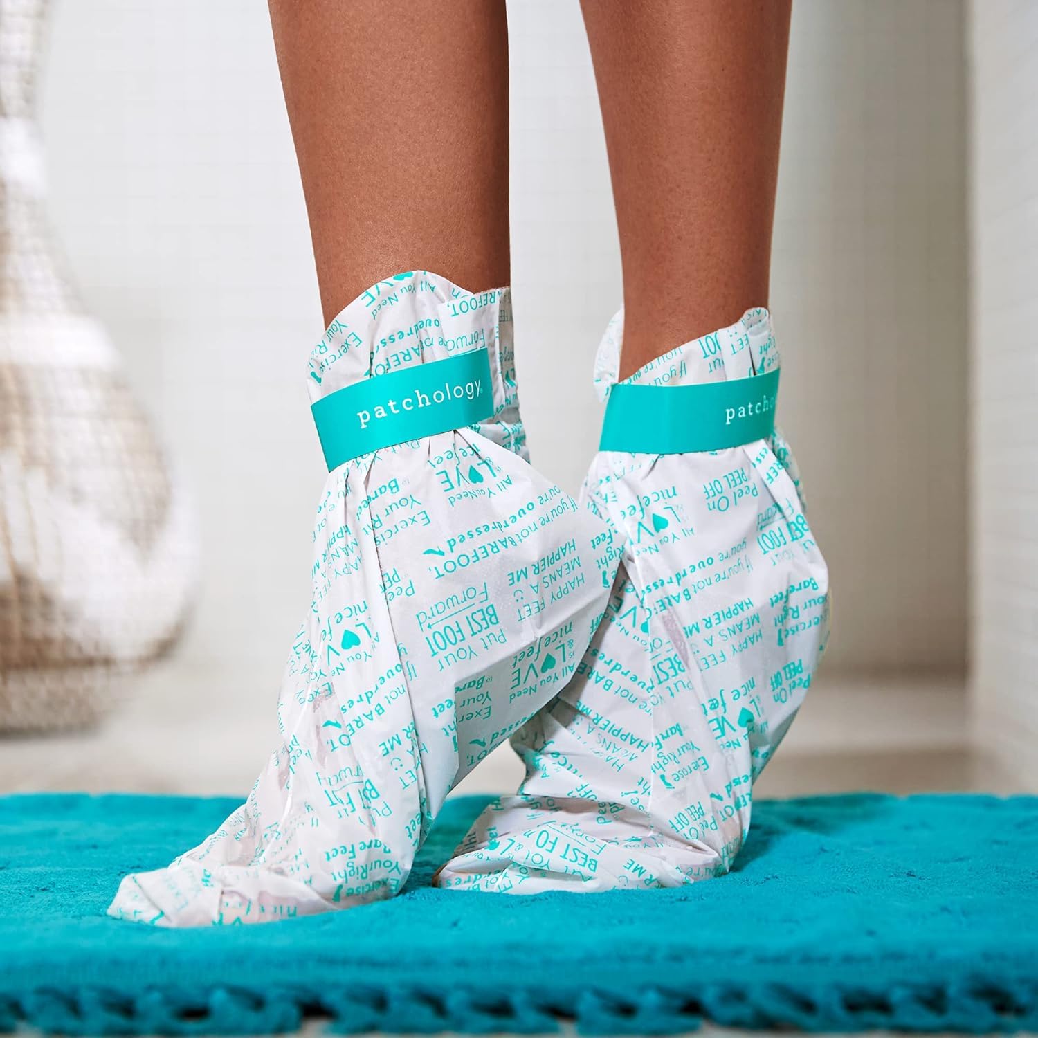 Detailed view of the activating essence and booties for foot peel treatment.