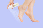 Model demonstrating foot peeling spray application on dry heel