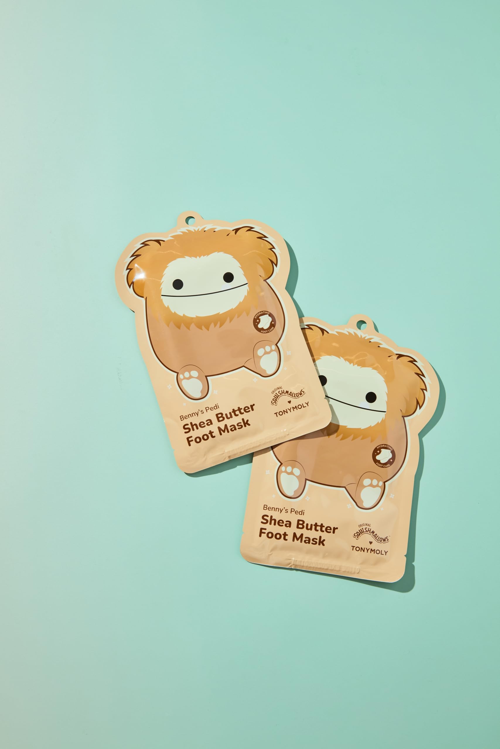 TONYMOLY Benny the Bigfoot foot mask packaging highlighting key benefits for dry cracked heels.