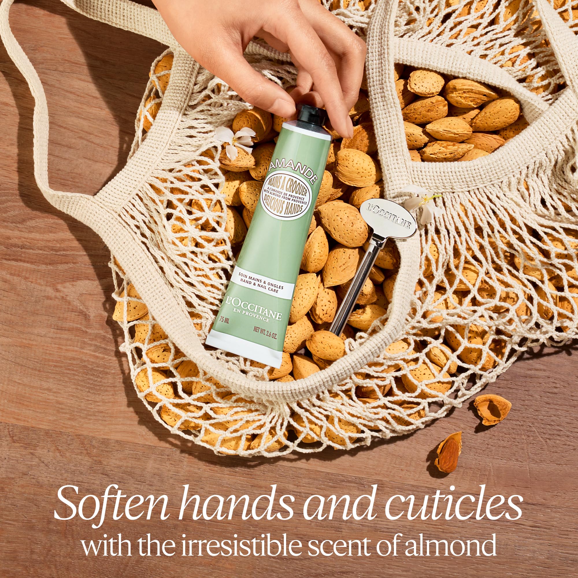Travel sized L'Occitane Almond Delicious Hands tube showcasing authentic French skincare packaging.