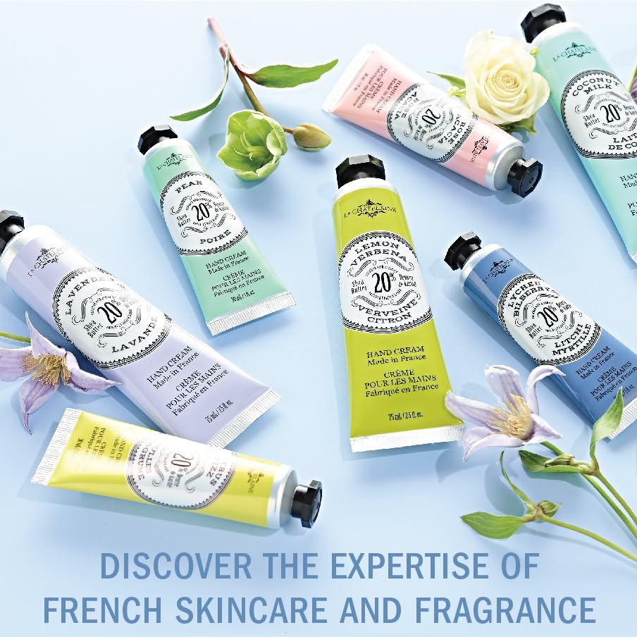 La Chatelaine French made lavender scented hand lotion tube placed next to fresh purple lavender blossoms