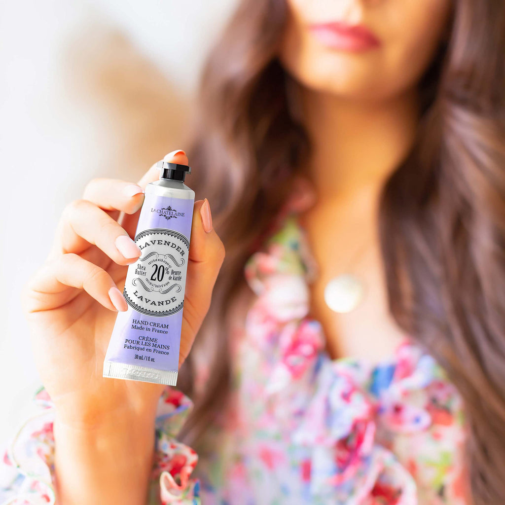 Hand holding La Chatelaine lavender moisturizing lotion