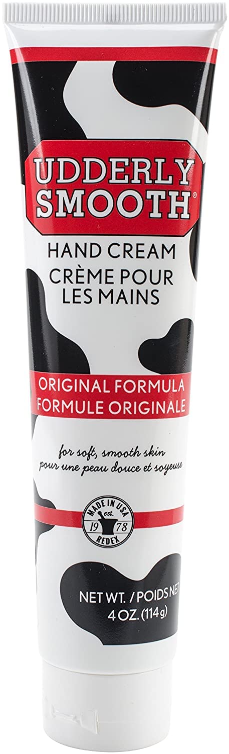 Texture demonstration showing the lightweight non greasy white cream consistency of Udderly Smooth moisturizer