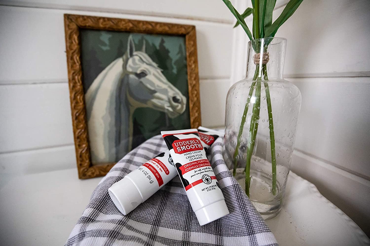 Authentic imported Udderly Smooth daily personal care hand lotion tubes angled view showing the original USA design