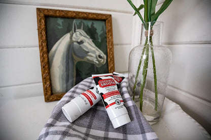 Authentic imported Udderly Smooth daily personal care hand lotion tubes angled view showing the original USA design