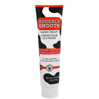 Size perspective of the portable four ounce Udderly Smooth hand cream tube held naturally to show scale