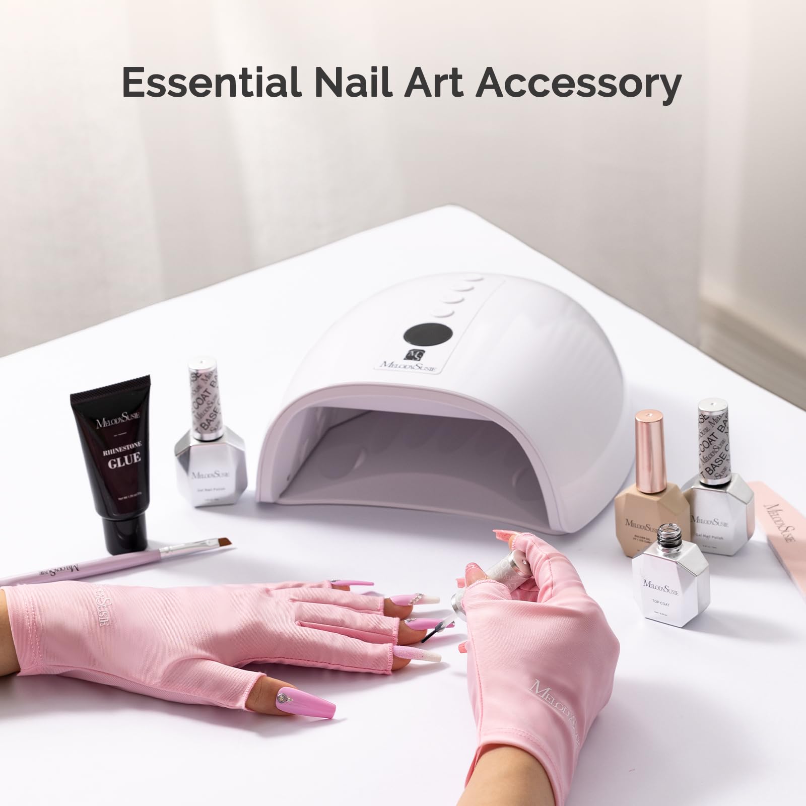 Woman wearing pink MelodySusie UV shield gloves for gel nail lamp