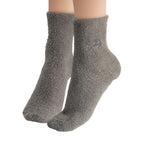 Socks shown worn on feet demonstrating fit and coverage