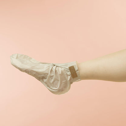Voesh moisturizing collagen socks being worn on feet