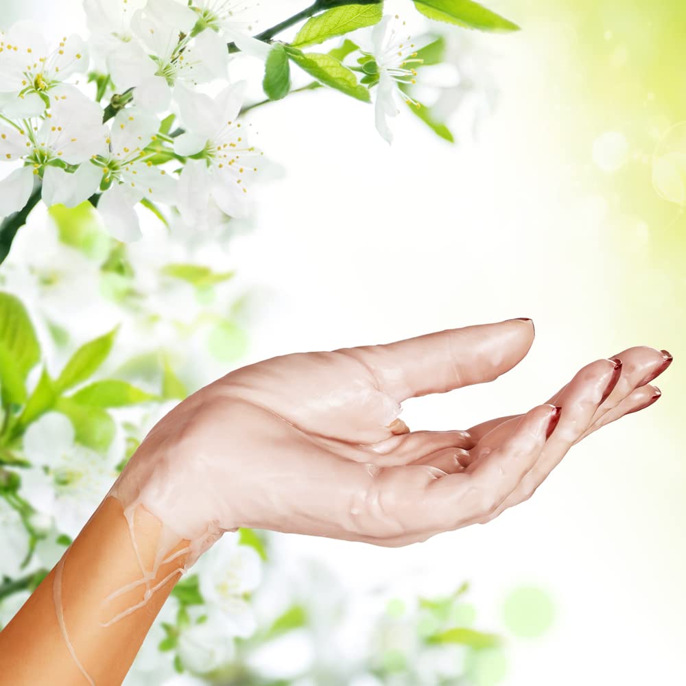 Moisturizing paraffin wax being applied to hands and feet for deep heat therapy skin treatment.
