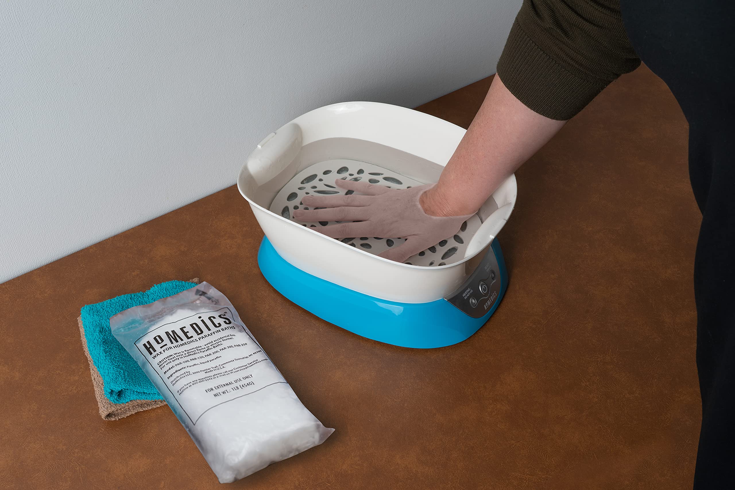 Thermal therapy paraffin wax cubes with plastic liners for joint pain relief