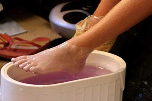 Peach scented hypoallergenic paraffin wax beads melting in a professional warmer machine