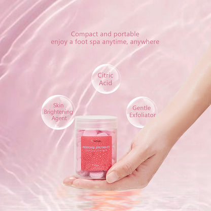 Person using Noval pedicure tablet for home foot spa