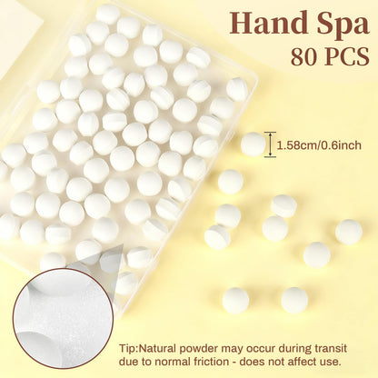 Effervescent manicure soaking tablets dissolving in water