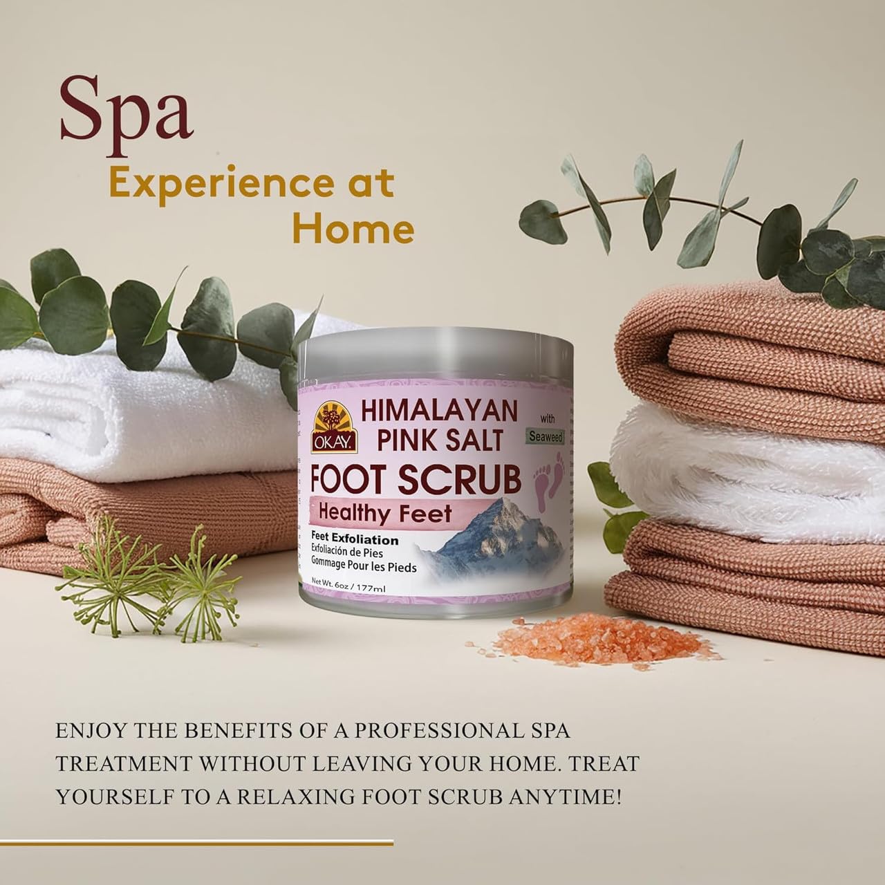 OKAY premium foot scrub texture showing natural walnut powder and pink salt granules.
