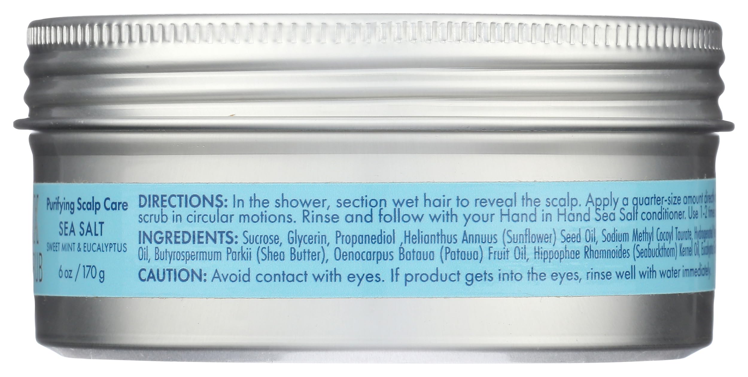 Applying Hand In Hand scalp scrub to wet hair