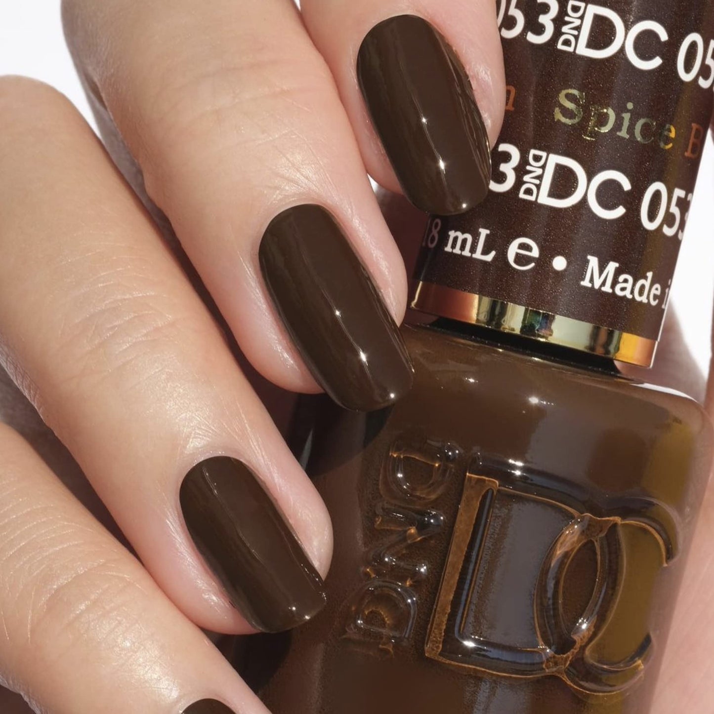 Daisy DND Spiced Brown gel and lacquer bottles side by side