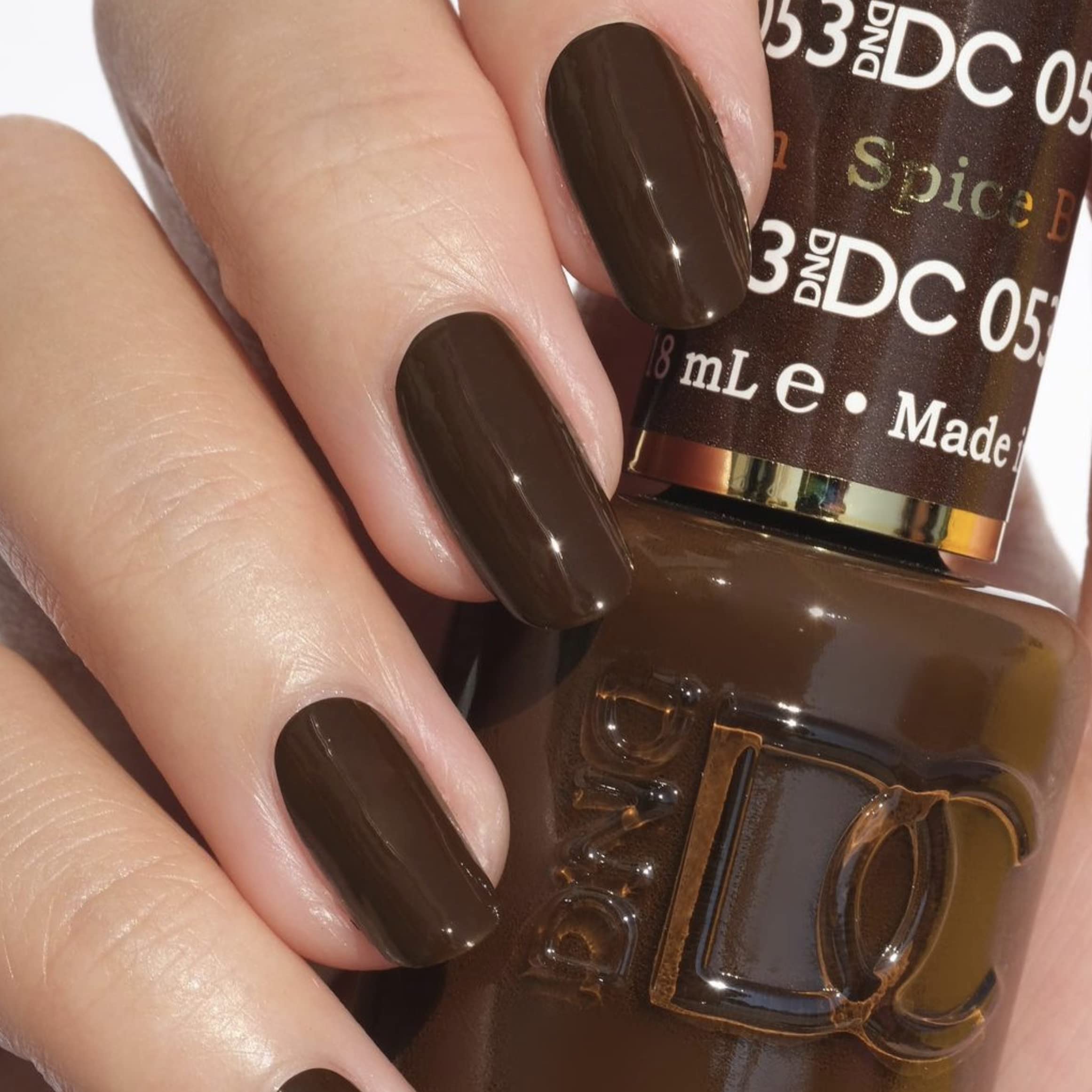 Daisy DND Spiced Brown gel and lacquer bottles side by side