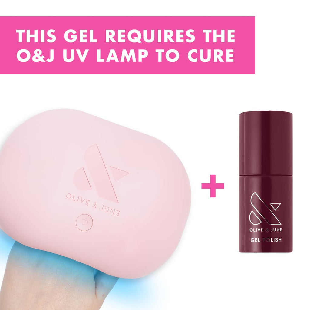 Olive and June gel nail polish bottle displayed next to LED curing lamp