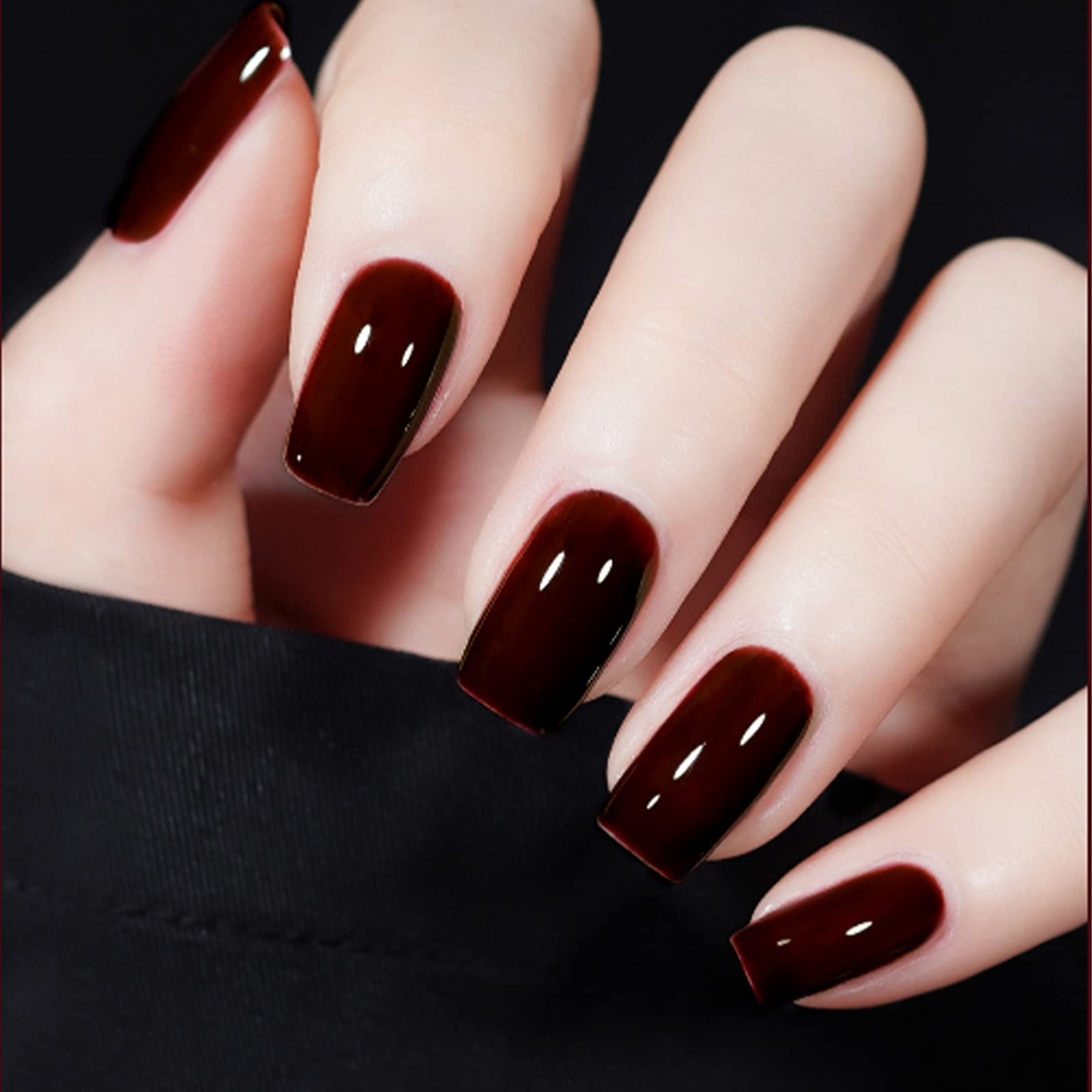 Close up of deep cherry red gel polish texture on nail