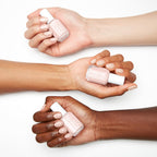 Swatched fingers displaying the glossy shine finish of the pale pink lacquer.