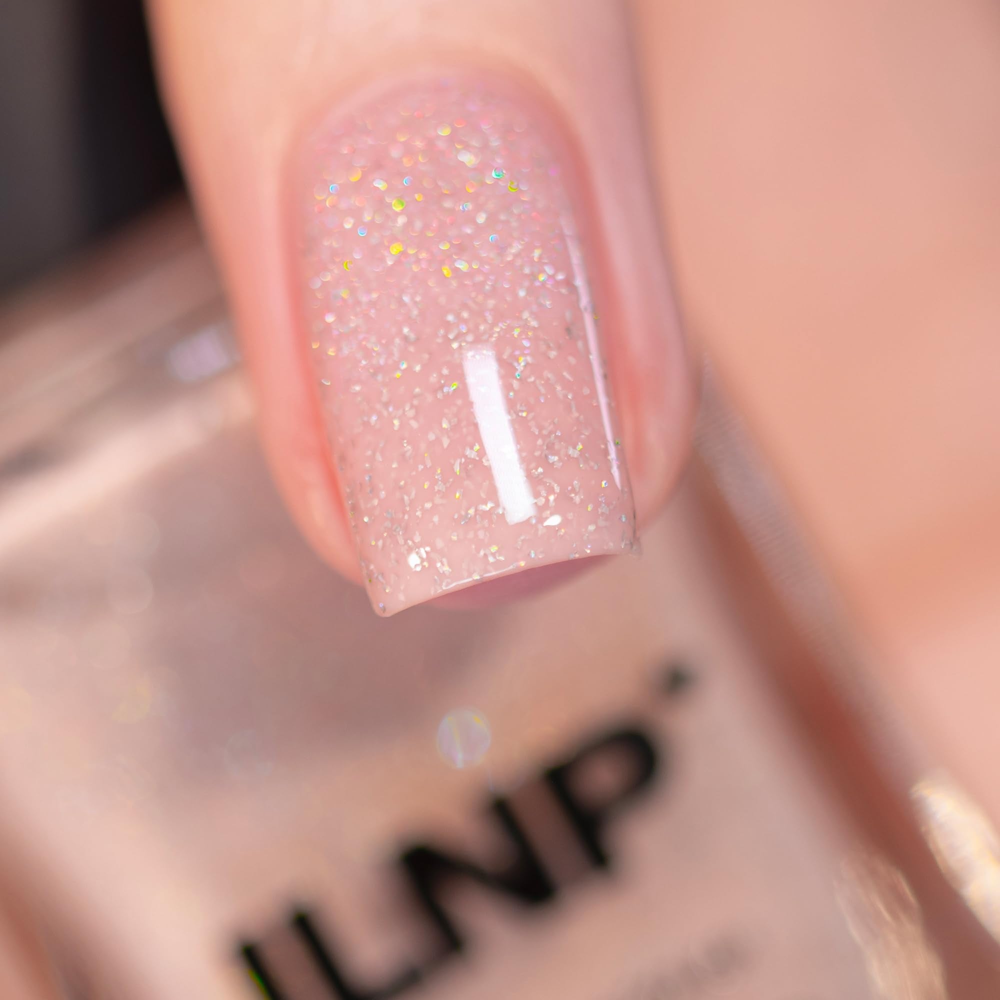 Close up of ILNP Birthday Suit nail polish bottle label