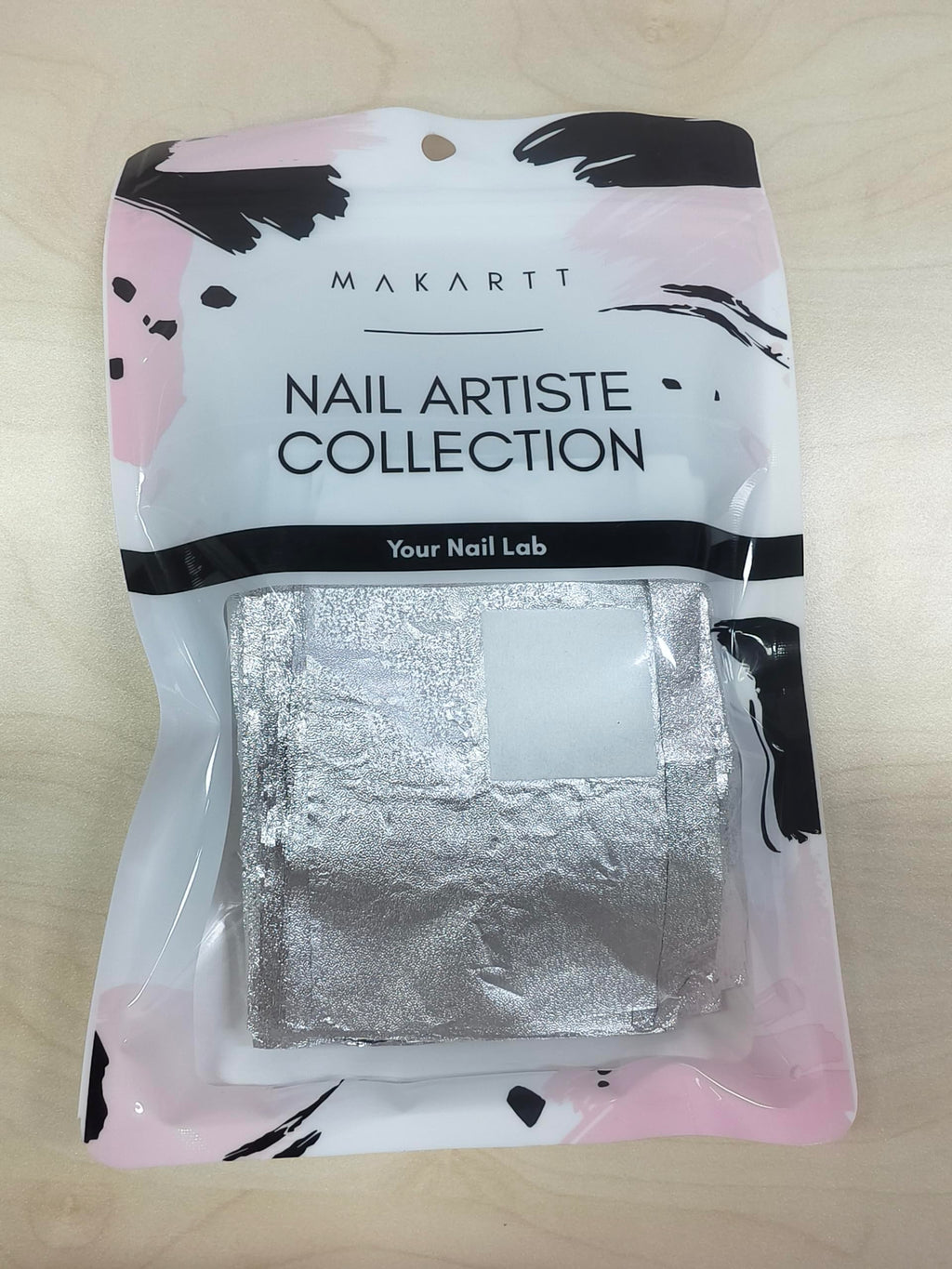 Stack of aluminum foil nail wraps ready for use