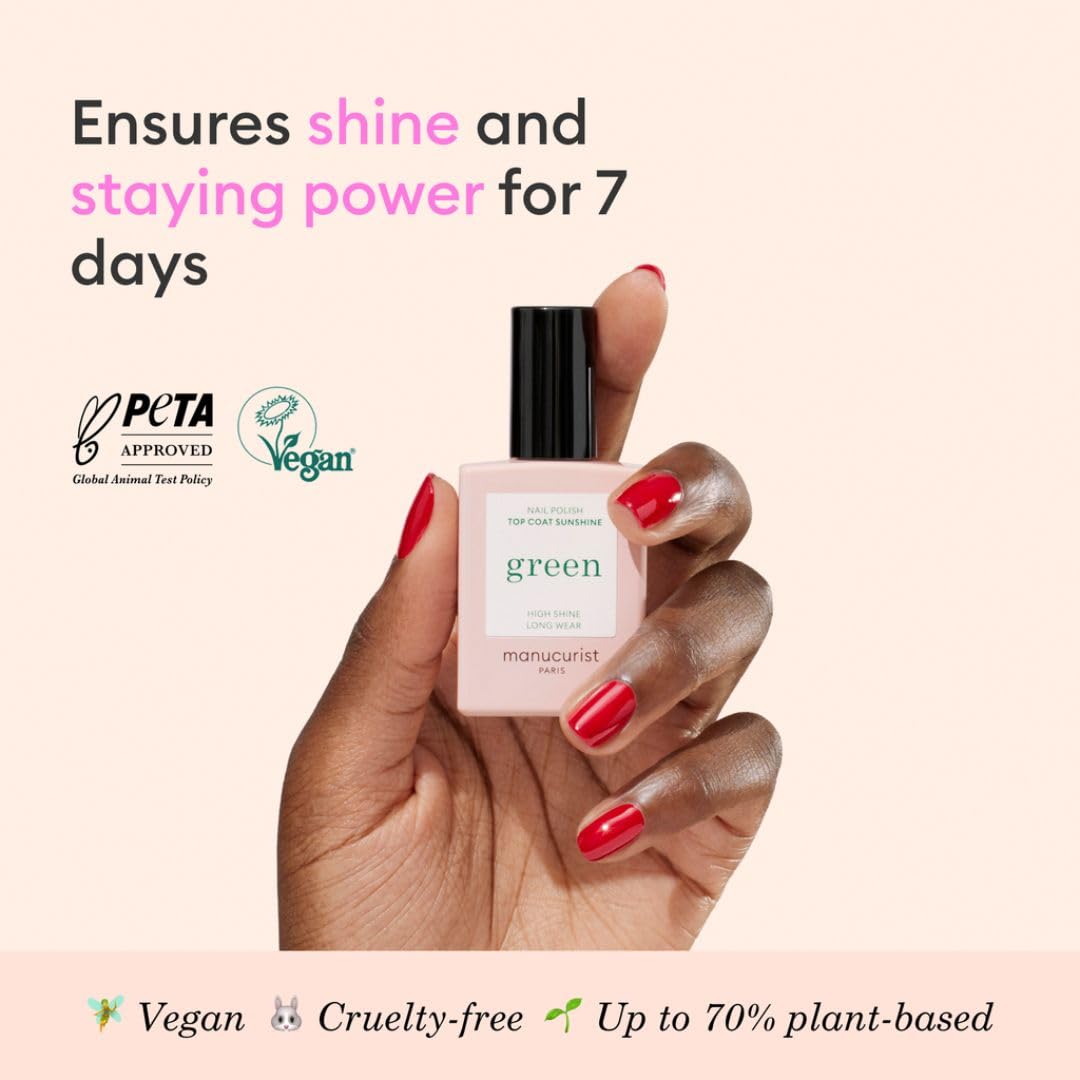 Manucurist plant based vegan top coat bottle being applied to manicured fingernails
