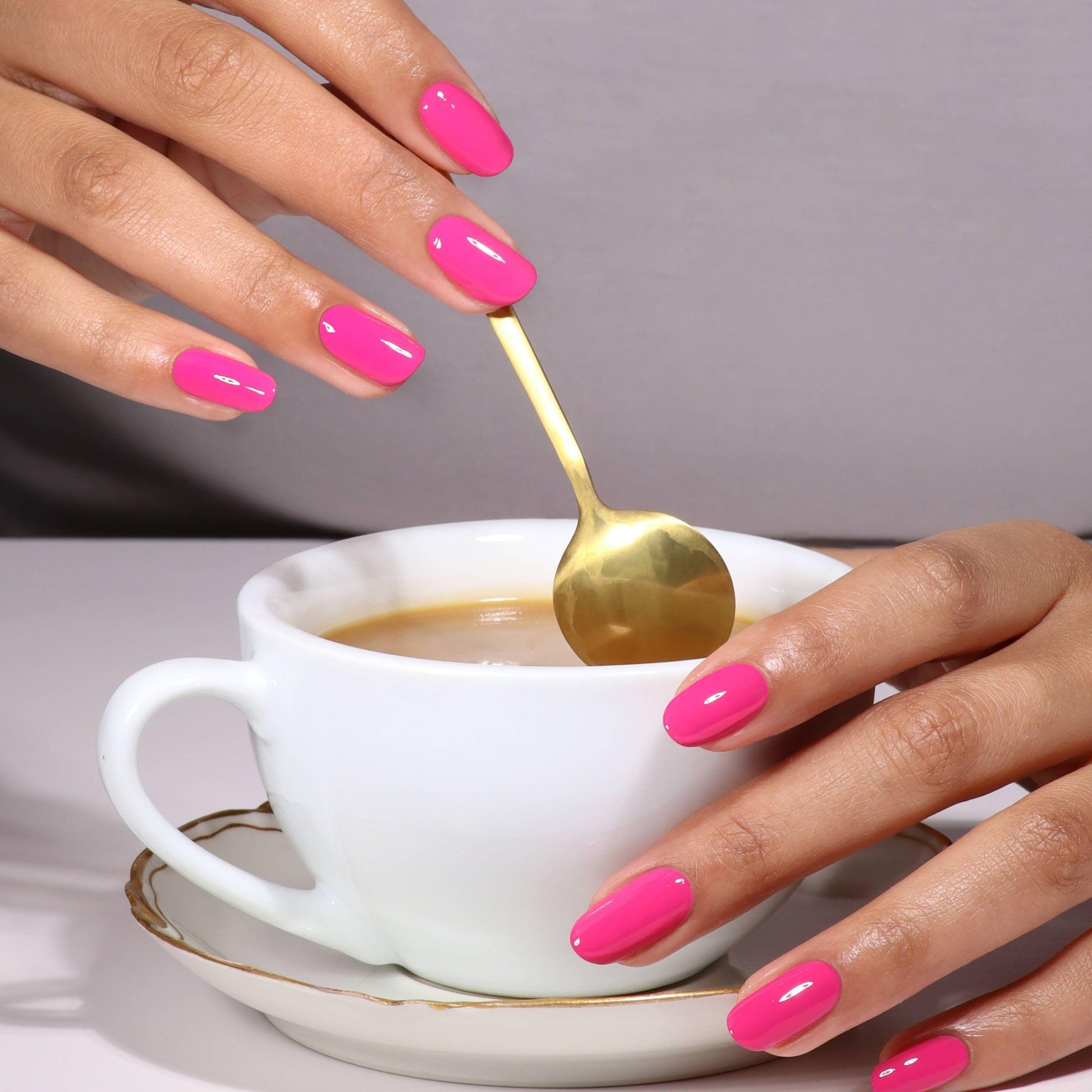 At home salon quality manicure process using UV LED curing lamp with gel top coat