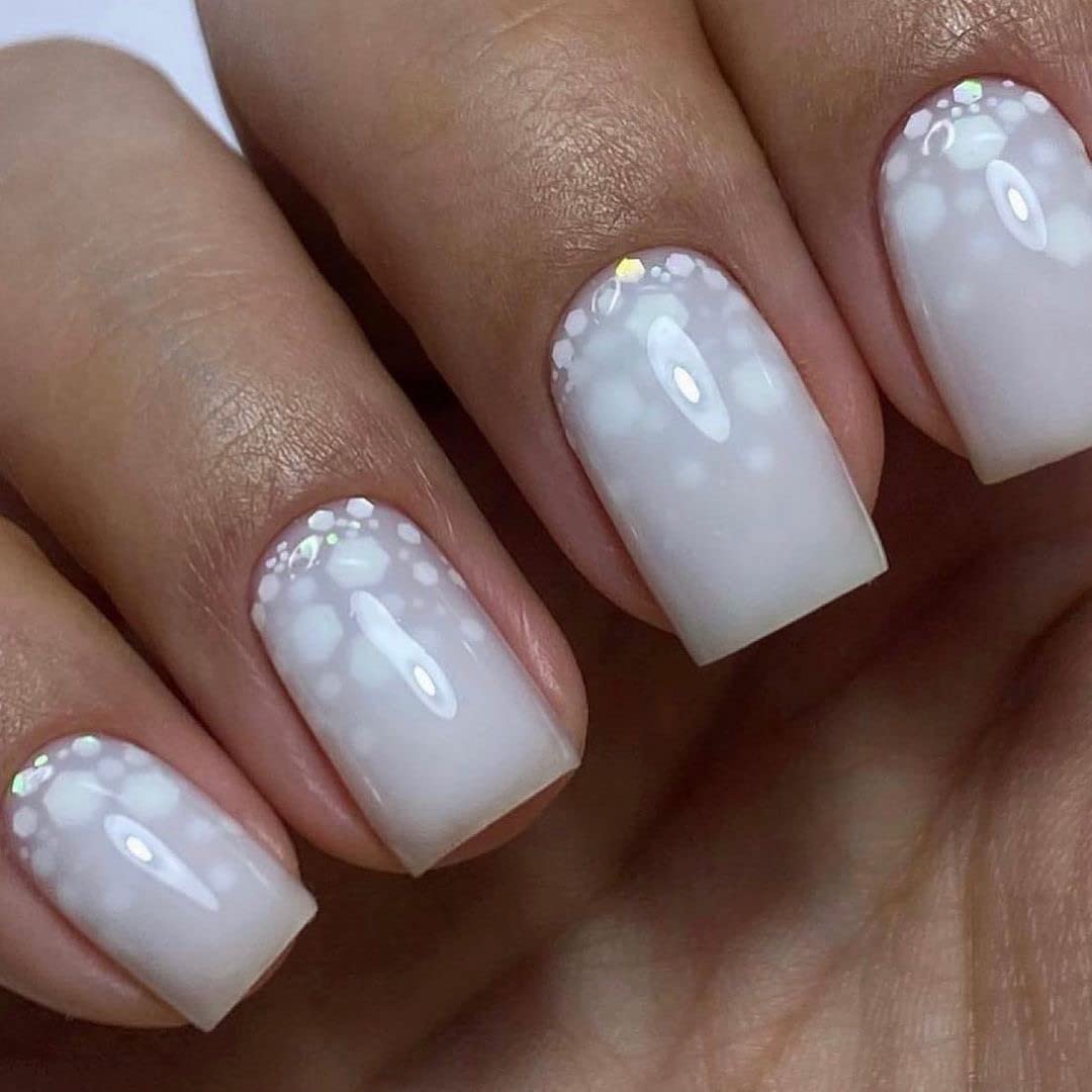 IN.HYPE tinted gel top coat bottle demonstrating the thick self leveling texture.