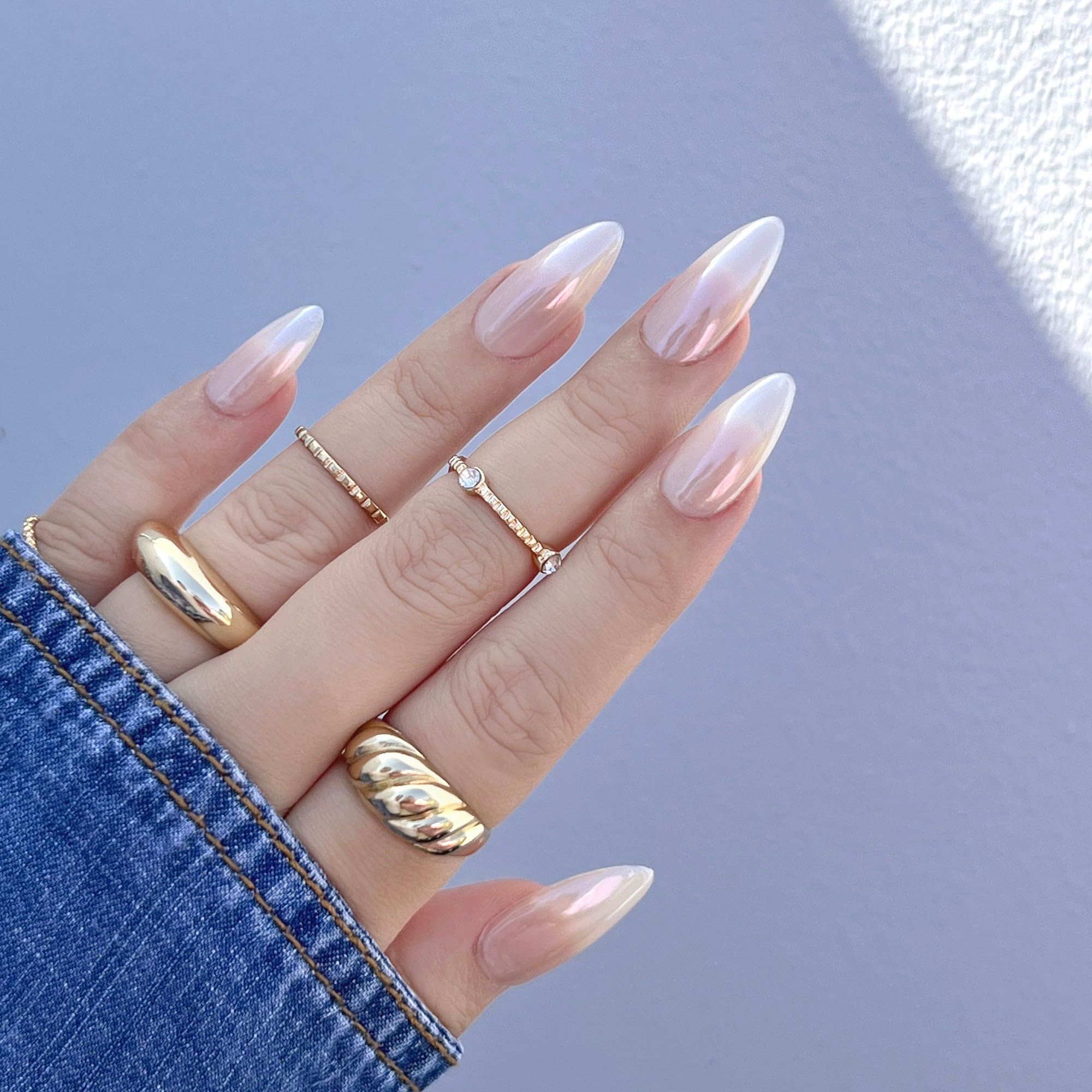 Clear liquid consistency of Daily Charme chrome effect formula on a professional nail brush