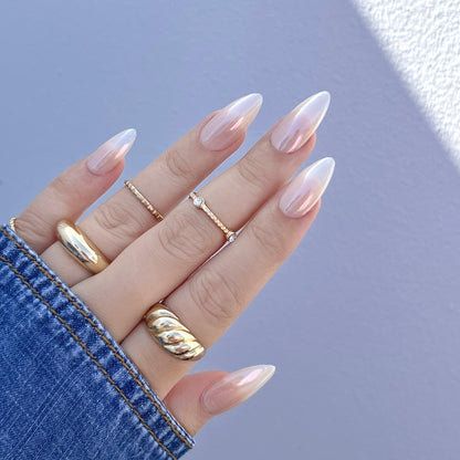 Clear liquid consistency of Daily Charme chrome effect formula on a professional nail brush