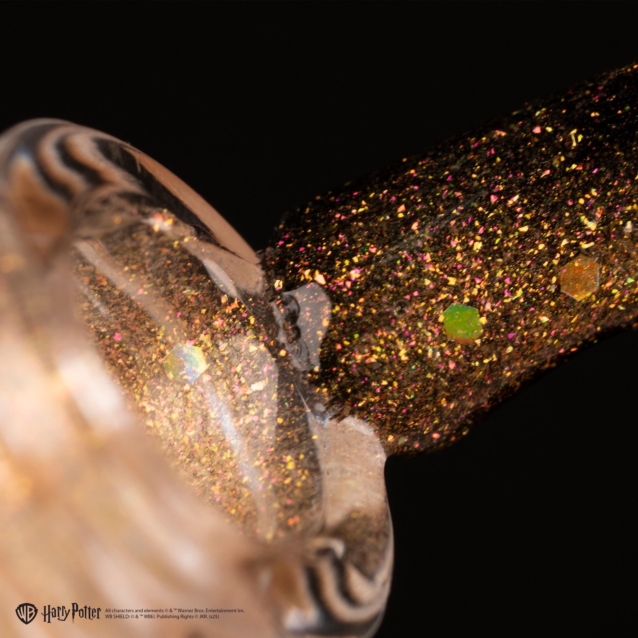 Authentic USA imported Orly sheer gold nail topper bottle showcasing the clear liquid with holographic glitter pieces.