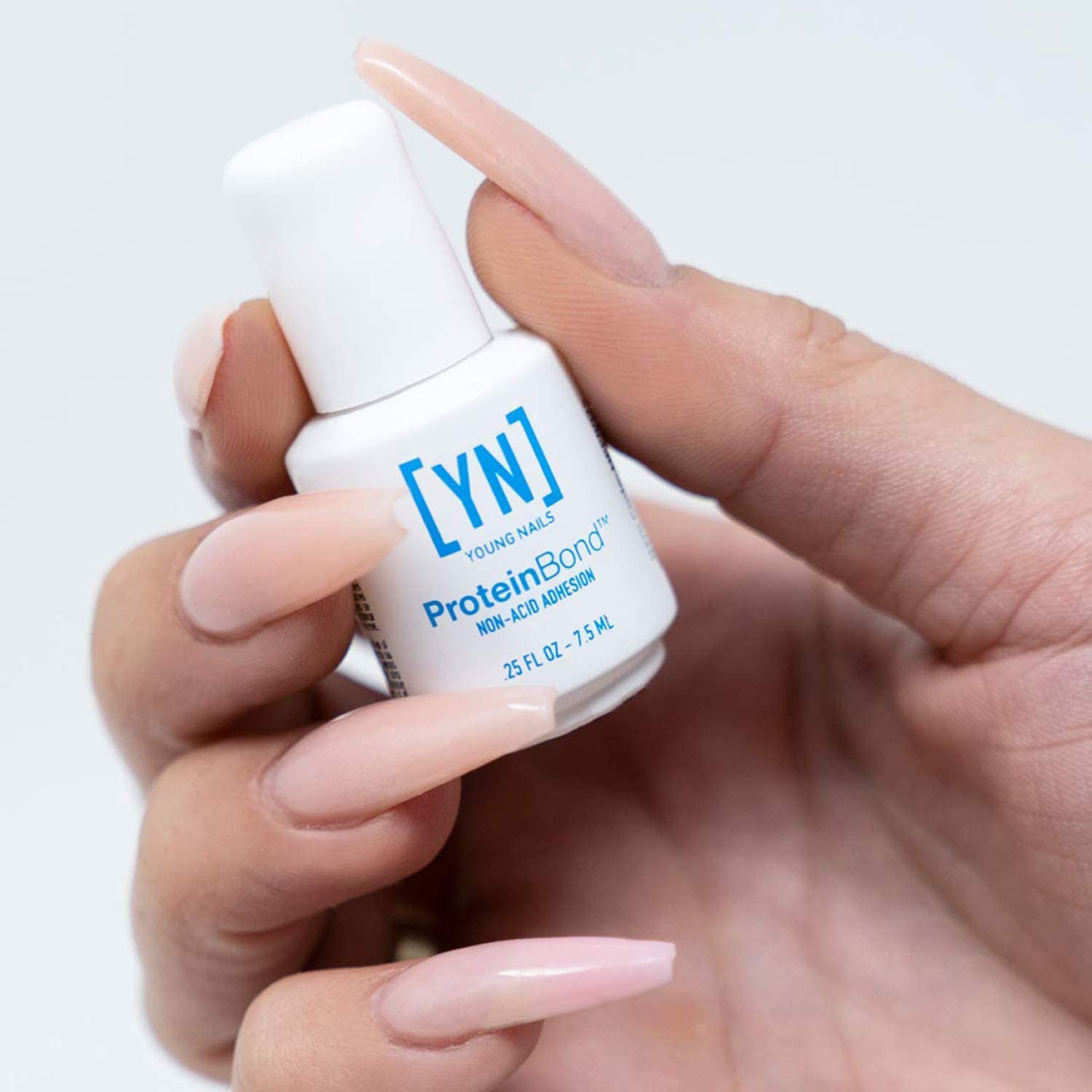 Young Nails PH bonder showing the zero point two five ounce size brush applicator and bottle neck.