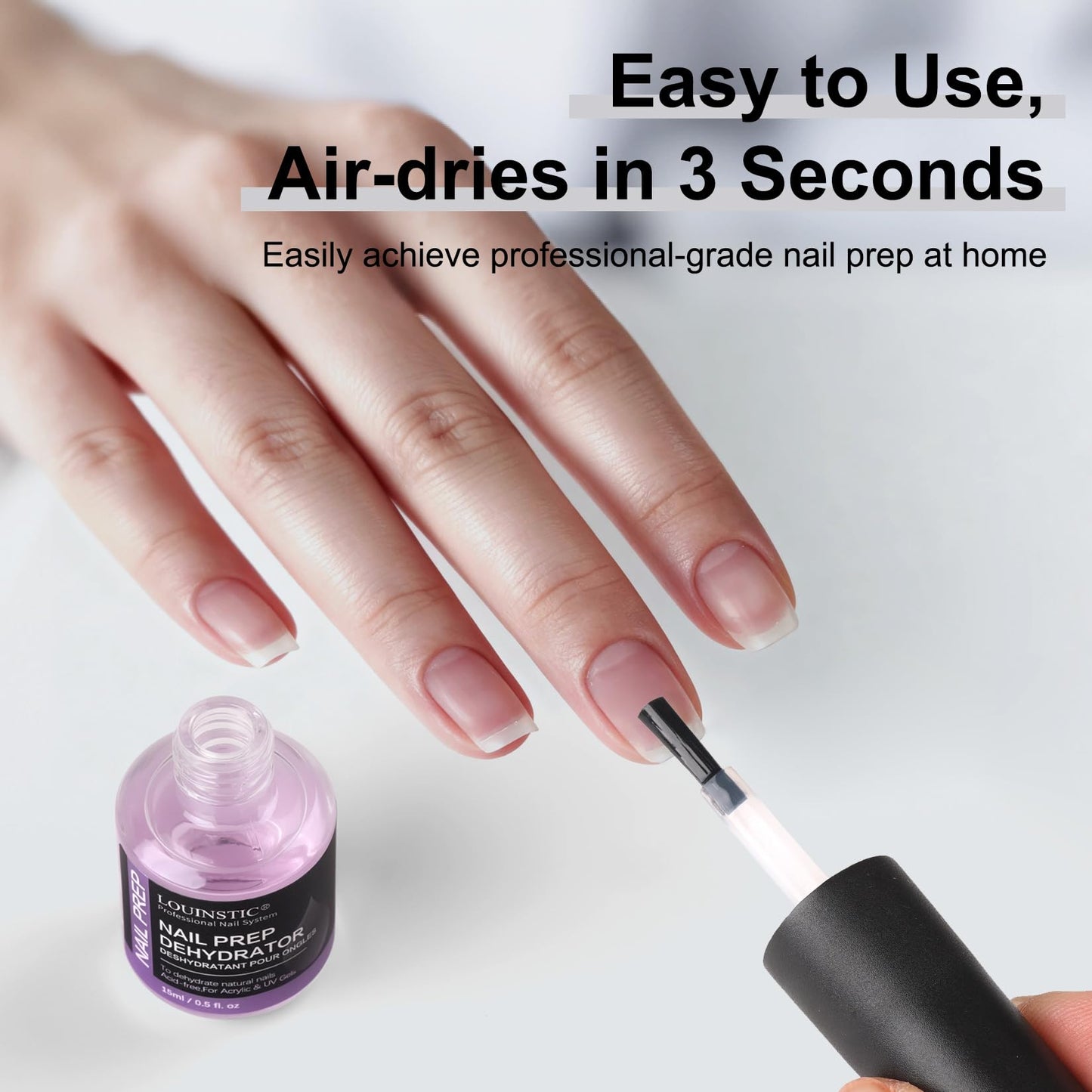 Applying Louinstic dehydrator during acrylic nail preparation