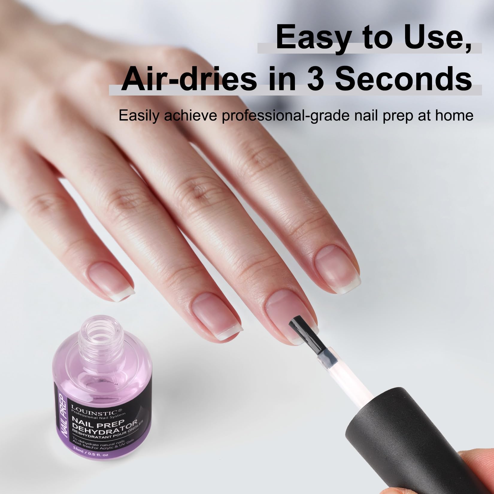 Applying Louinstic dehydrator during acrylic nail preparation
