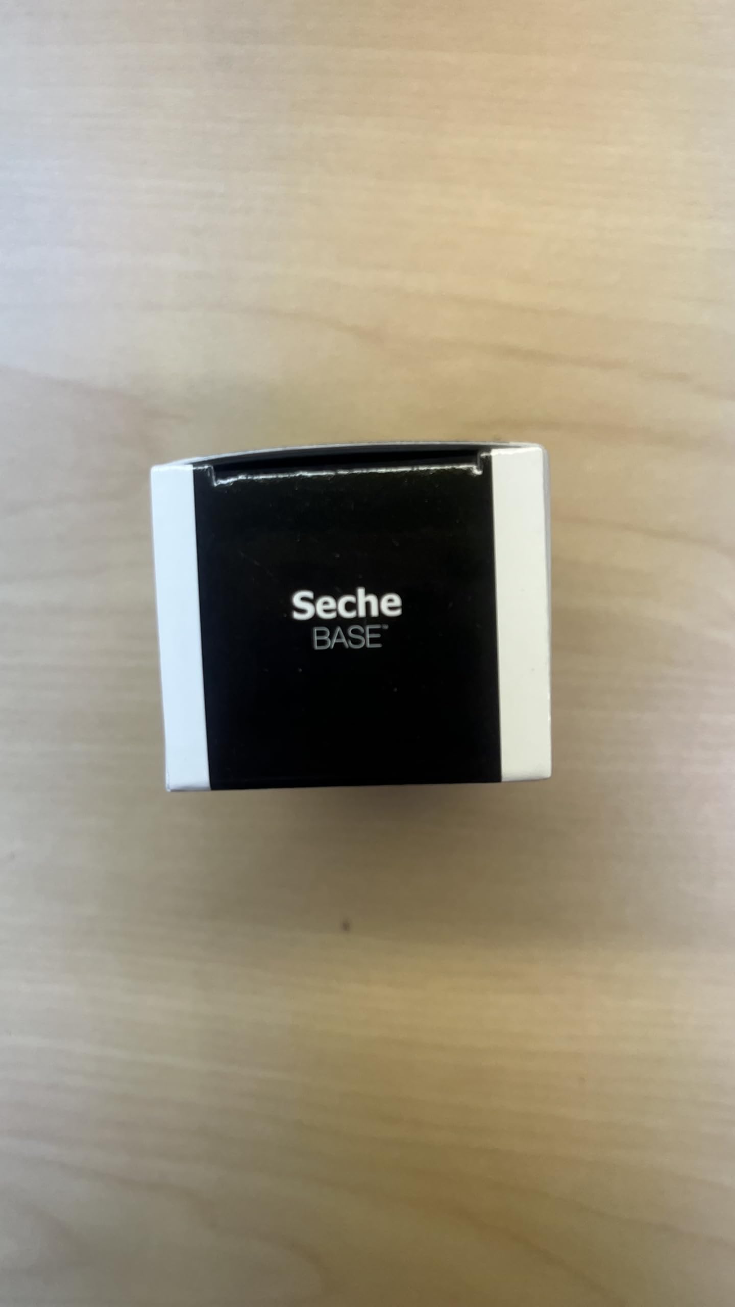 Seche base coat product shot illustrating the glass smooth finish on textured nails
