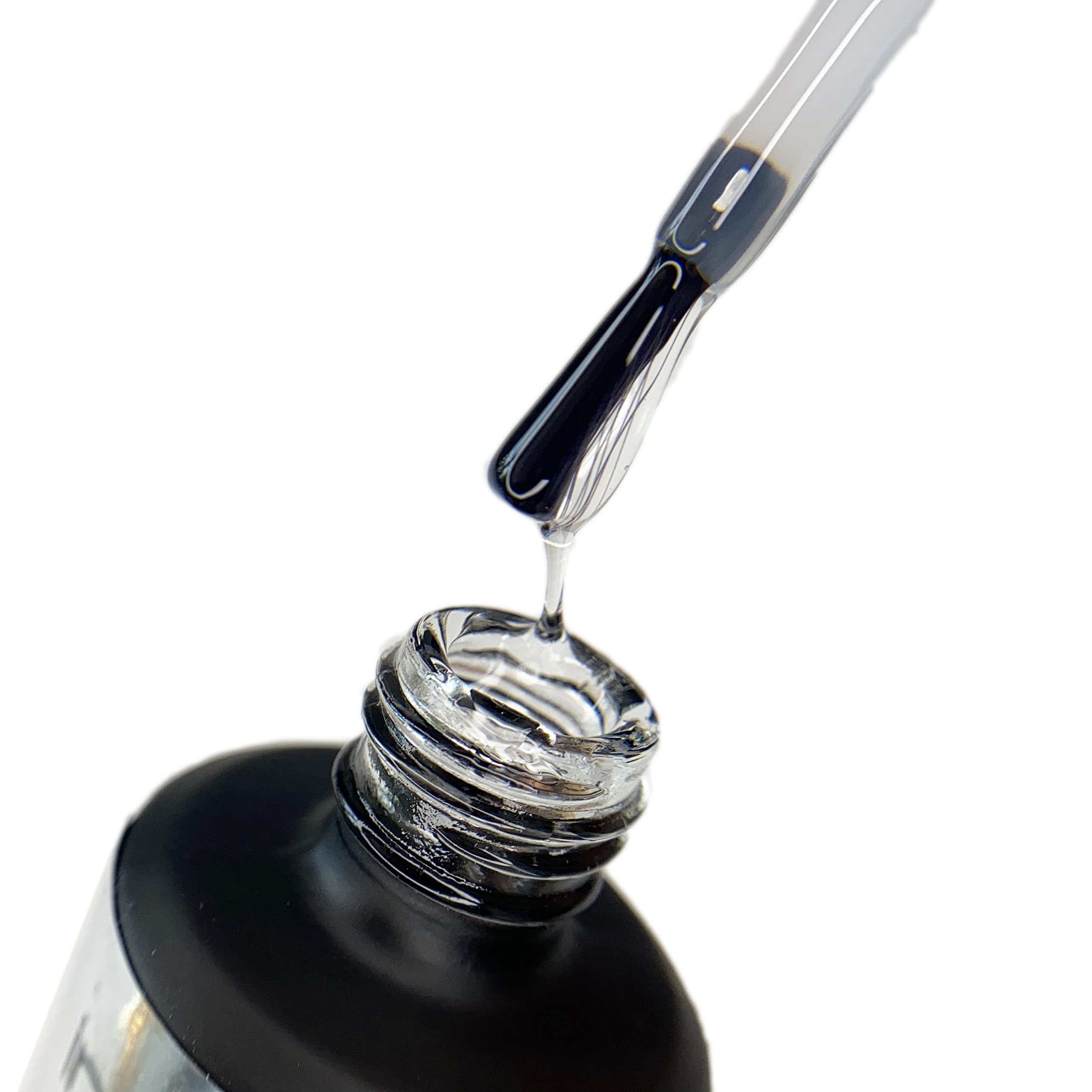 Thick self leveling texture of IN.HYPE strong base coat nail primer being applied with brush.