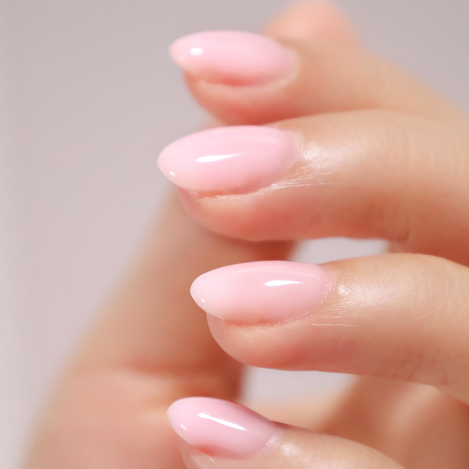 FZANEST 6-in-1 rubber base coat bottle sitting next to a finished glossy sheer red manicure layout.