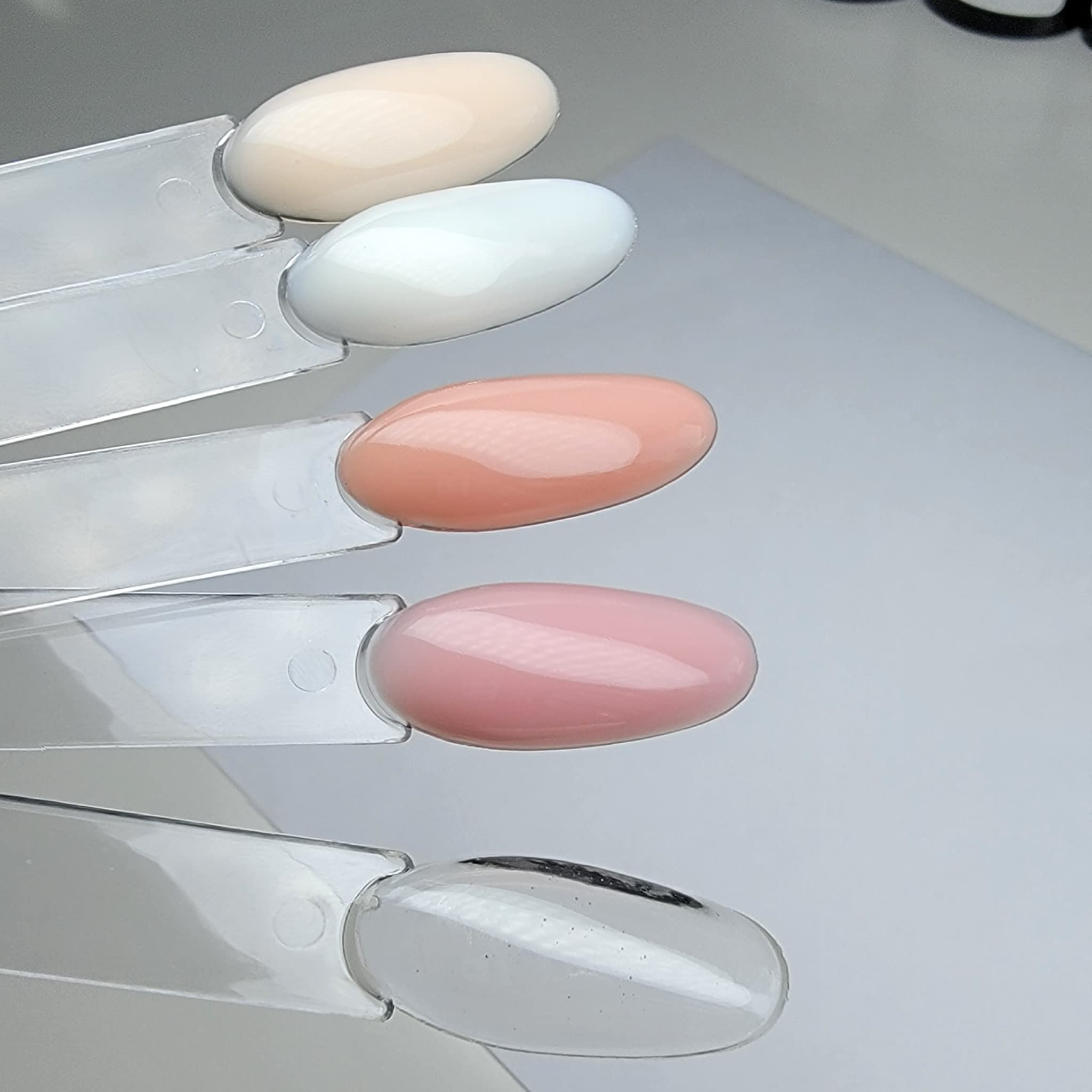 Dan's Nails professional high adhesion gel base layer bottle highlighting chip resistant nail protection properties.