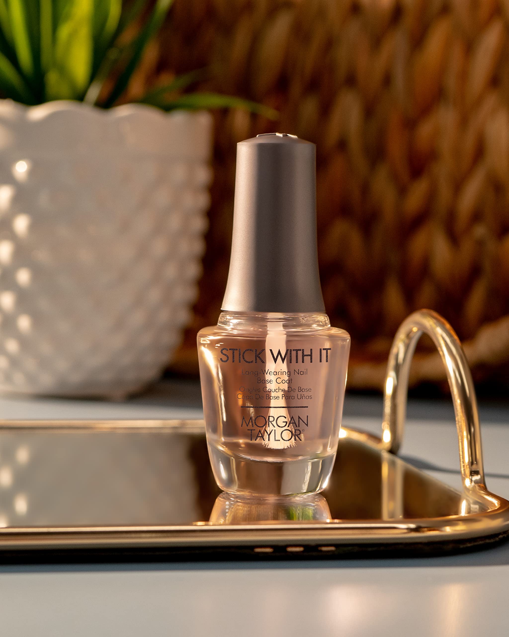 Morgan Taylor professional long lasting nail polish base coat showing ergonomic cap and clear bottle packaging
