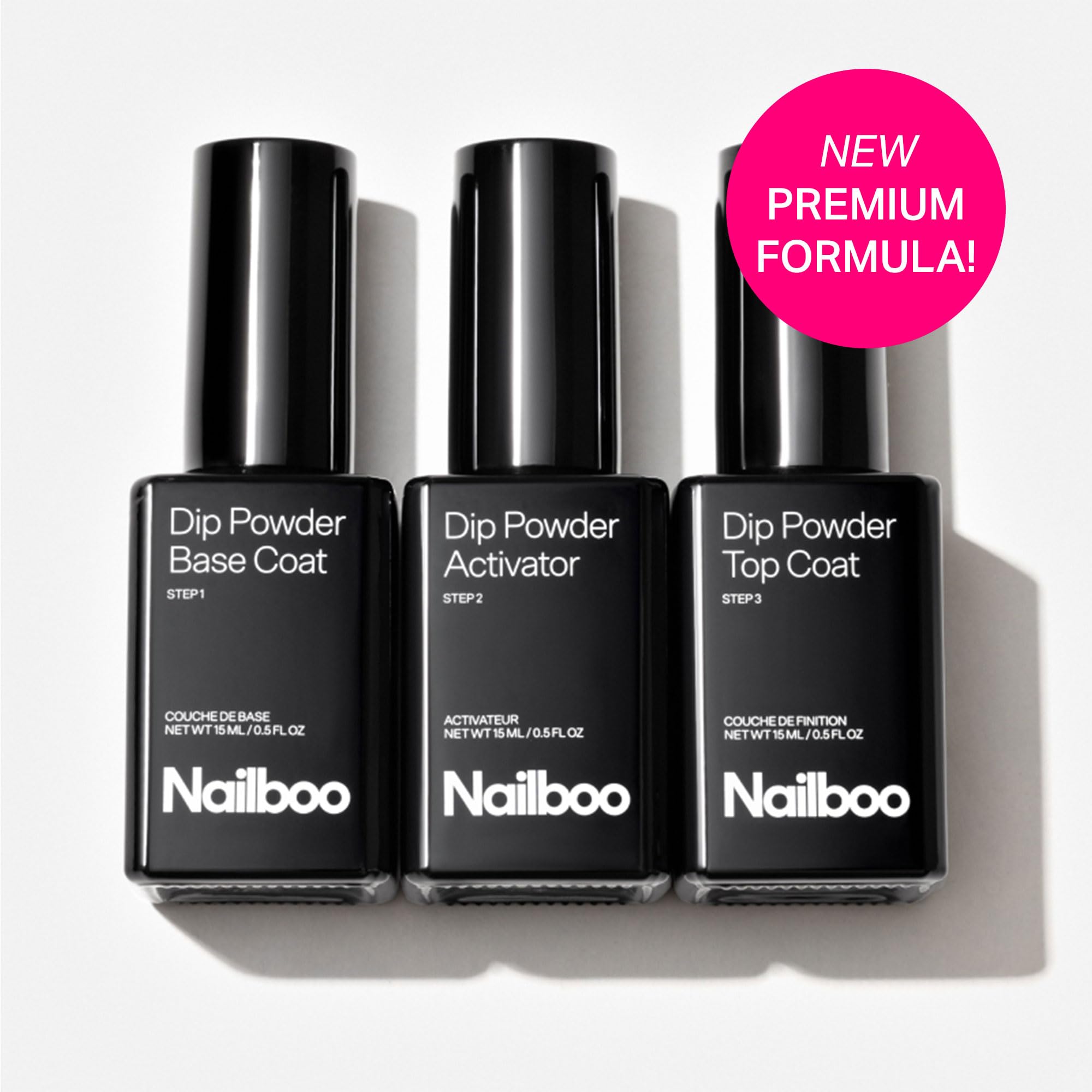 Three half fluid ounce bottles of Nailboo essential dip liquids arranged neatly on a clean background.
