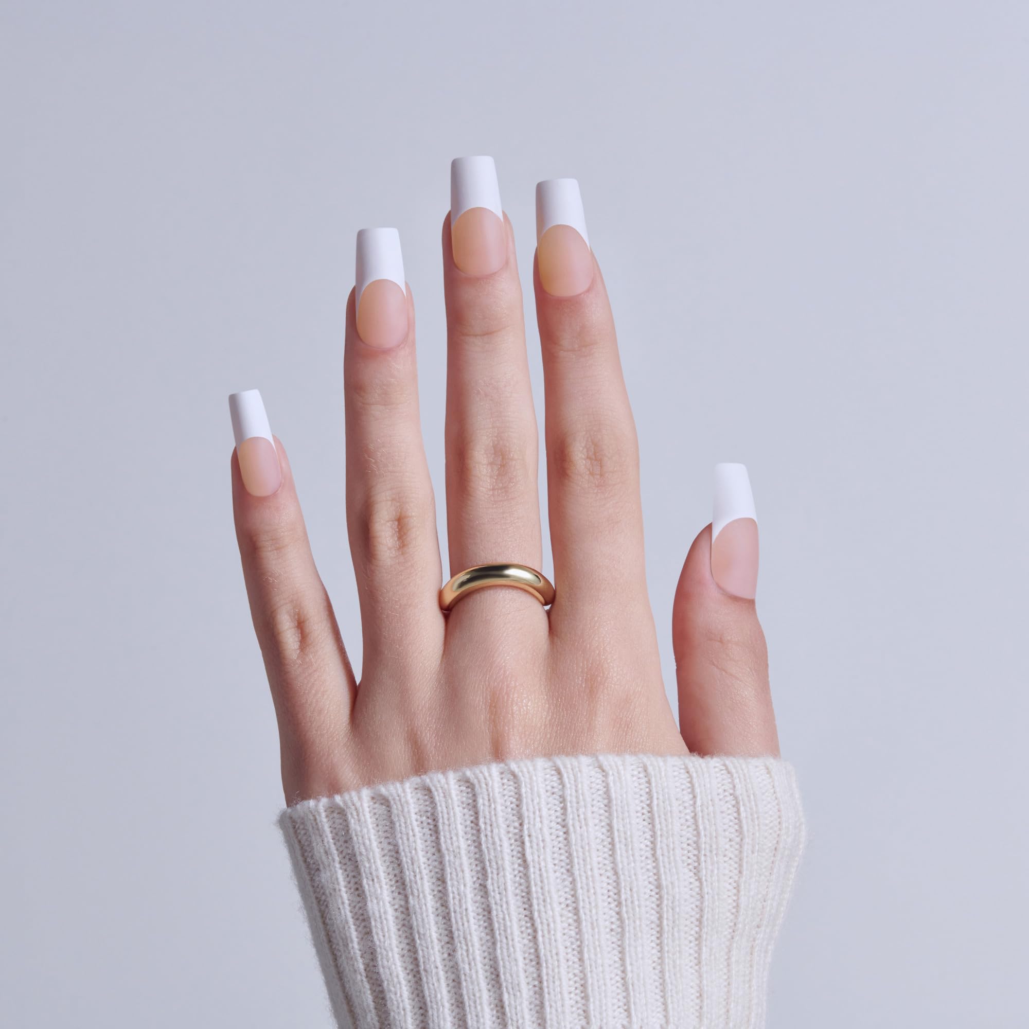 Close up of white French tip long square press on nails