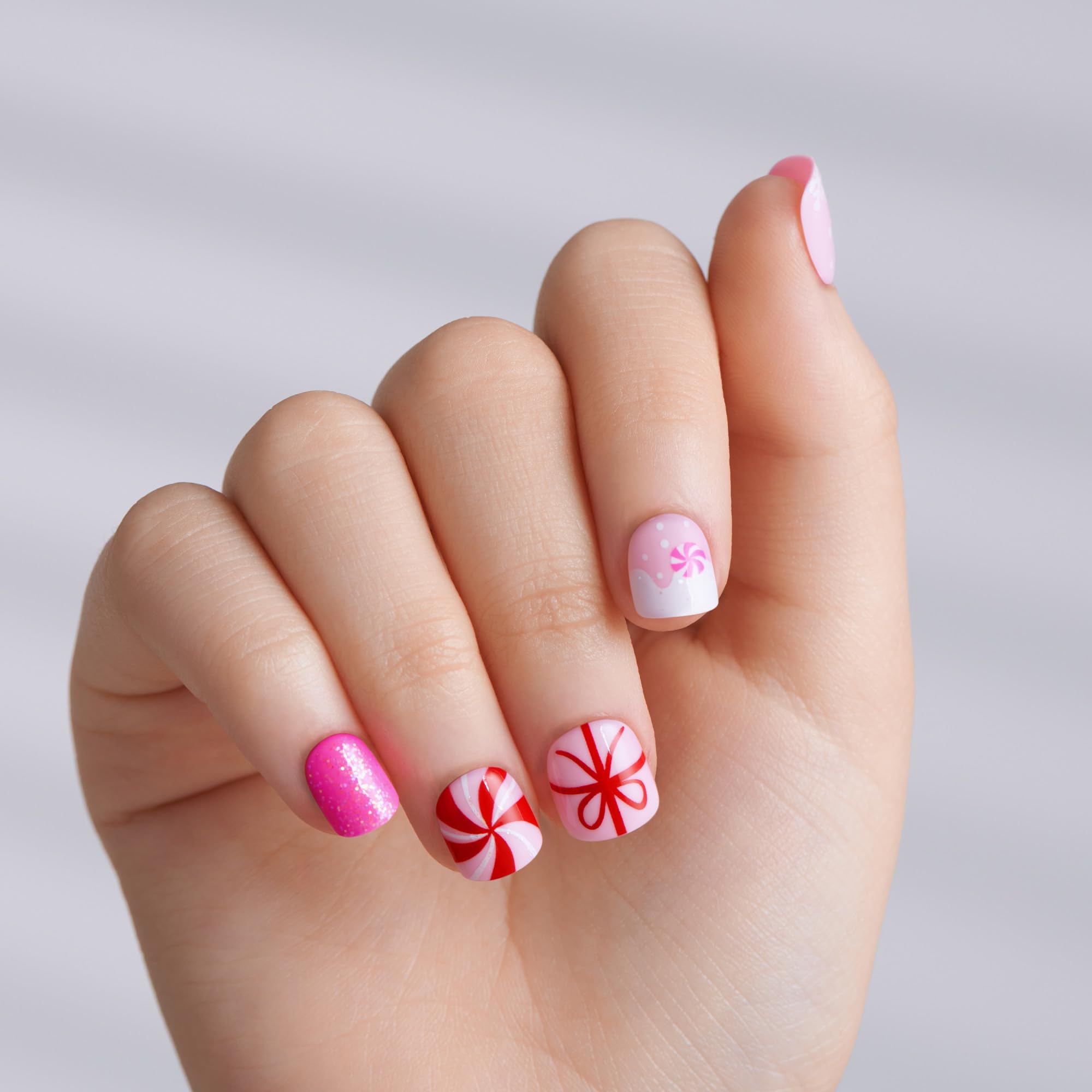 Close up of KISS imPRESS Frostsnow kids nail design with snowflakes